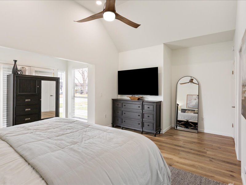 1205 South Main Street Georgetown, TX 78626 - Photo 15 of 35 a bedroom with a bed and a flat screen tv