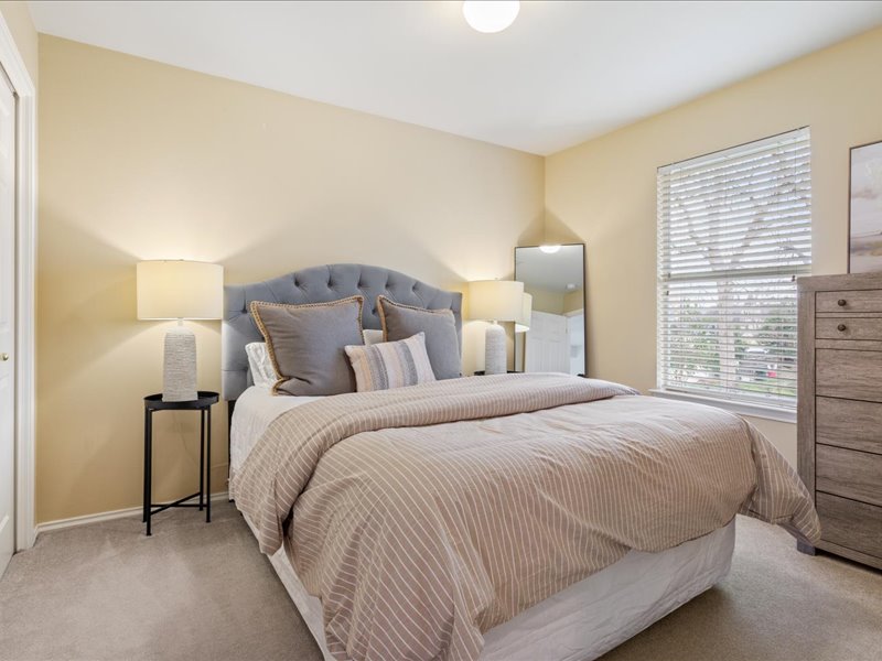 1205 South Main Street Georgetown, TX 78626 - Photo 20 of 35 a bedroom with a bed and a window