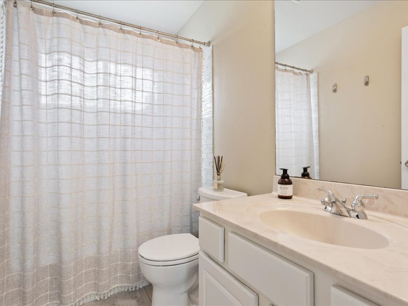 1205 South Main Street Georgetown, TX 78626 - Photo 24 of 35 a bathroom with a sink toilet and shower
