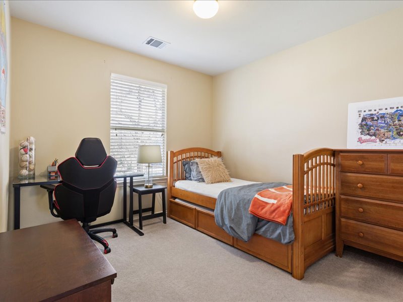 1205 South Main Street Georgetown, TX 78626 - Photo 25 of 35 a bedroom with a bed and a window