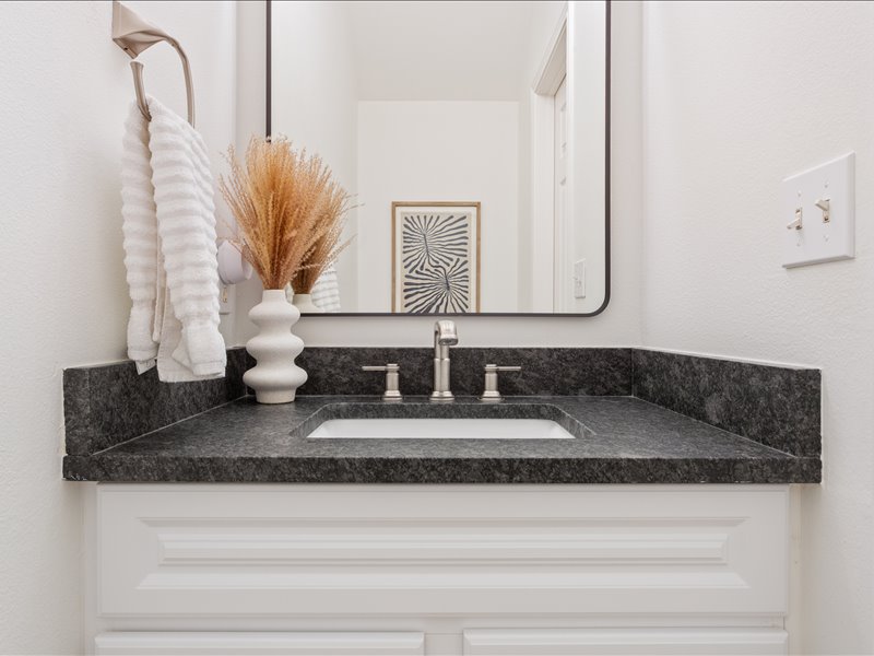 1205 South Main Street Georgetown, TX 78626 - Photo 26 of 35 a bathroom with sink and mirror