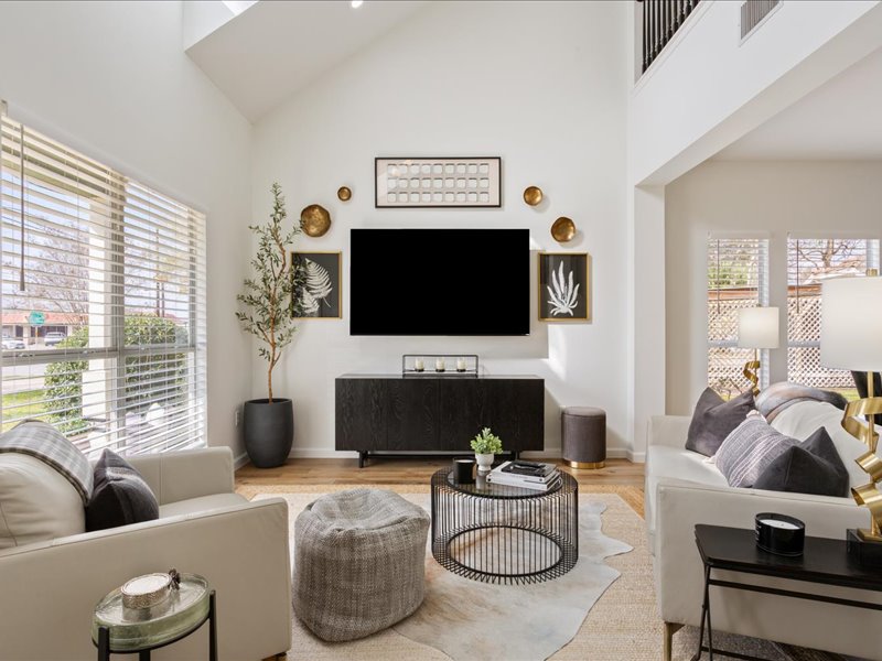 1205 South Main Street Georgetown, TX 78626 - Photo 3 of 35 a living room with furniture a fireplace and a flat screen tv