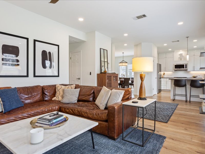 1205 South Main Street Georgetown, TX 78626 - Photo 10 of 35 a living room with furniture and a wooden floor