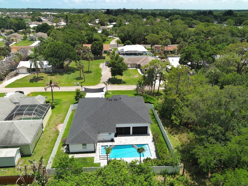 431 Midvale Terrace Sebastian, FL 32958 - Photo 31 of 34 an aerial view of a house with yard swimming pool and outdoor seating