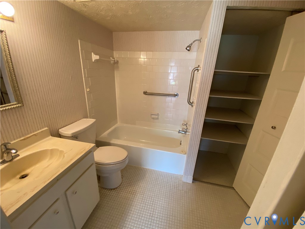 1507 Bronwyn Road, Unit 301 Henrico, VA 23238 - Photo 29 of 41 a bathroom with a granite countertop sink toilet and shower