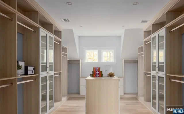 a view of kitchen with refrigerator and cabinet