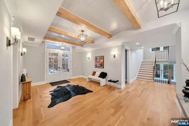 a living room with furniture fireplace and a large window