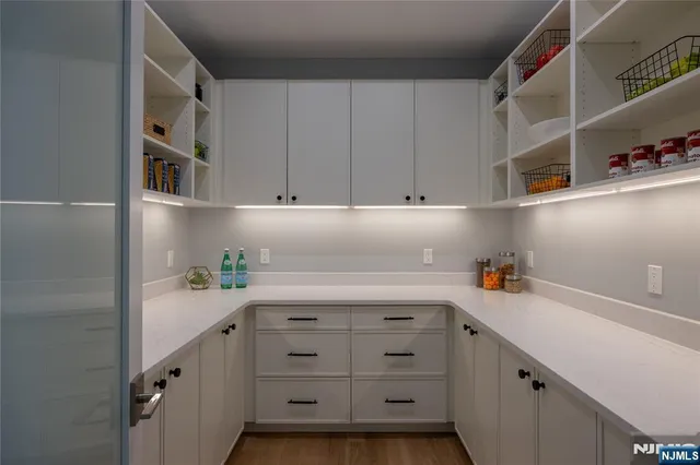 a kitchen with cabinets and window