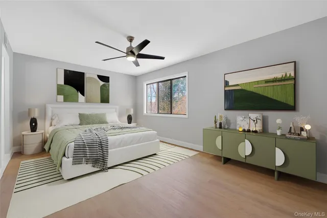 a bedroom with a bed and flat screen tv