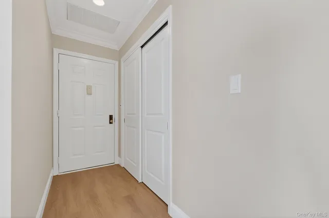 a view of an empty room with a window