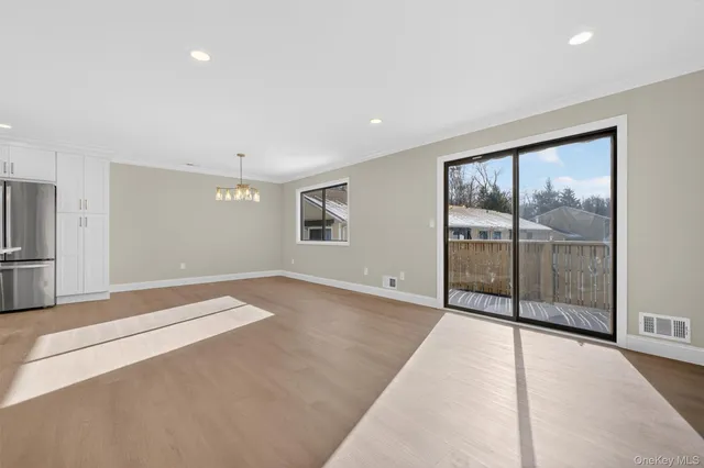 a view of a livingroom with a kitchen