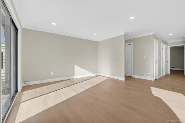 a view of a kitchen with a sink and cabinets