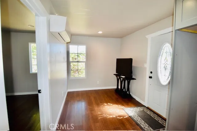 a view of an entryway with wooden floor