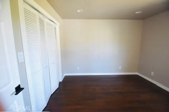 a view of a small space with wooden floor