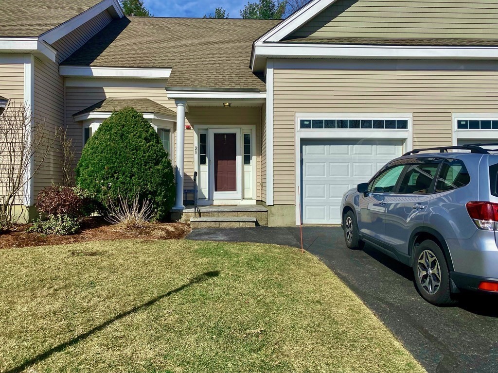 a view of a car in front of a house
