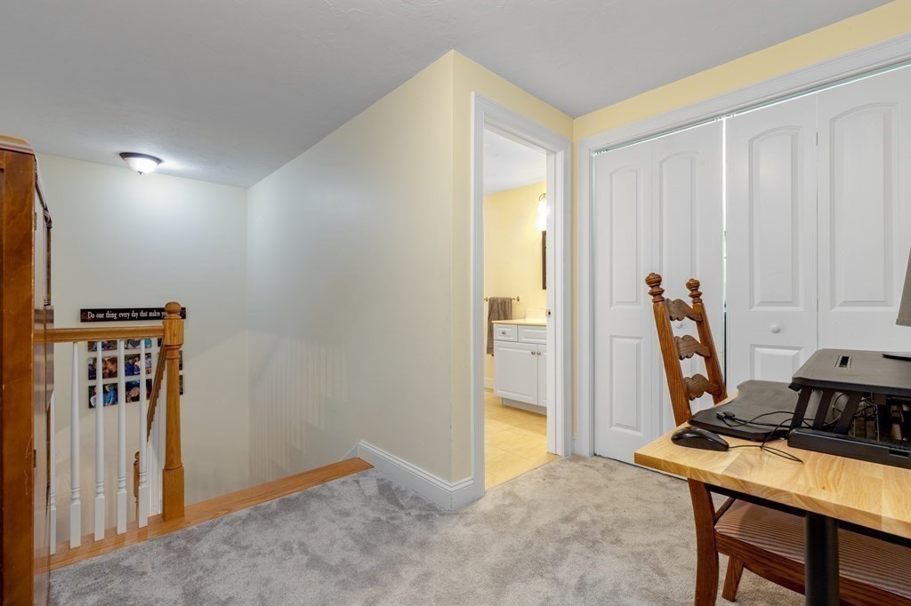 2 Charles Ridge Road, Unit D Littleton, MA 01460 - Photo 13 of 30 a view of workspace with wooden floor windows
