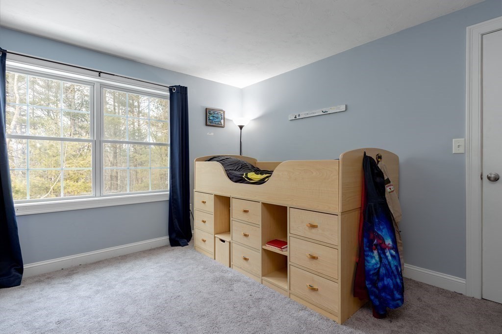 2 Charles Ridge Road, Unit D Littleton, MA 01460 - Photo 15 of 30 a room with window and dresser