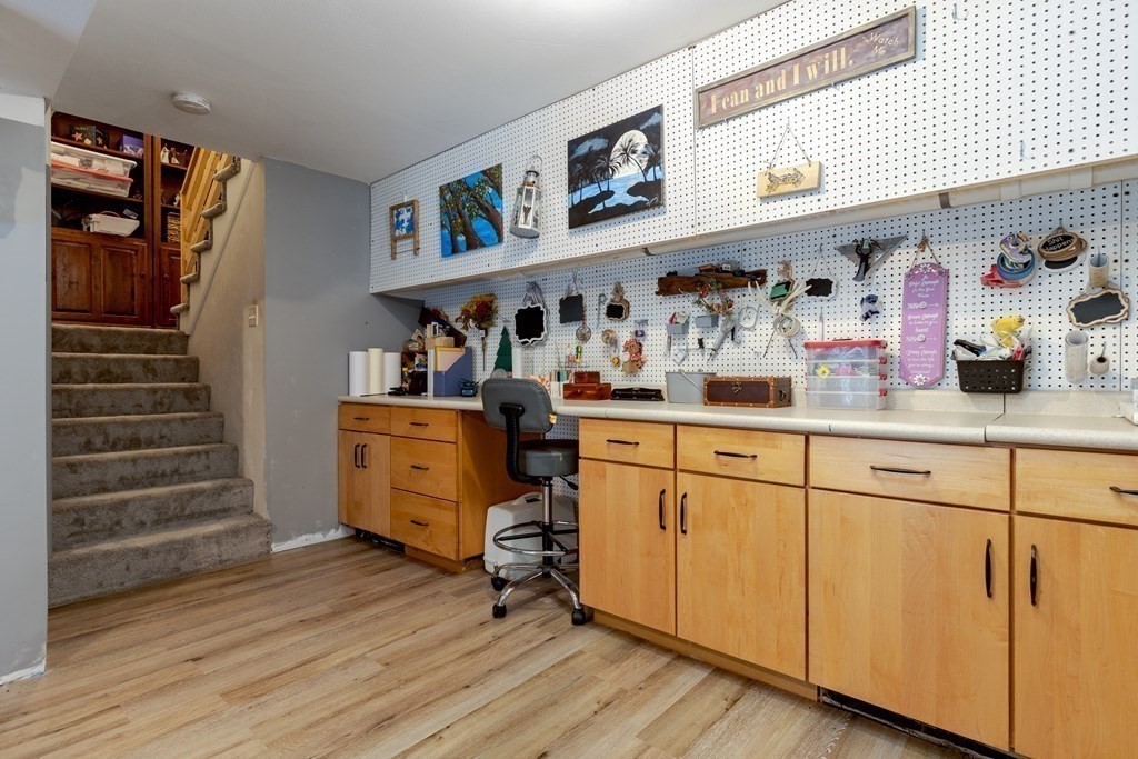 2 Charles Ridge Road, Unit D Littleton, MA 01460 - Photo 20 of 30 a view of kitchen with cabinets and wooden floor