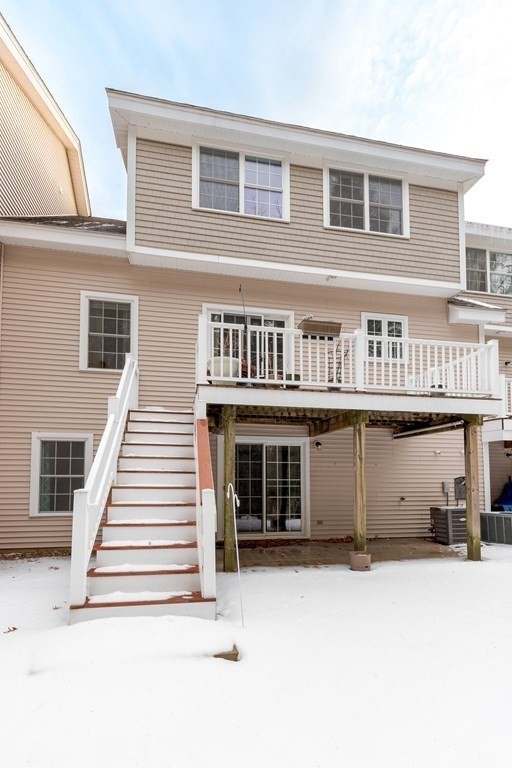 2 Charles Ridge Road, Unit D Littleton, MA 01460 - Photo 23 of 30 a front view of a house with a yard