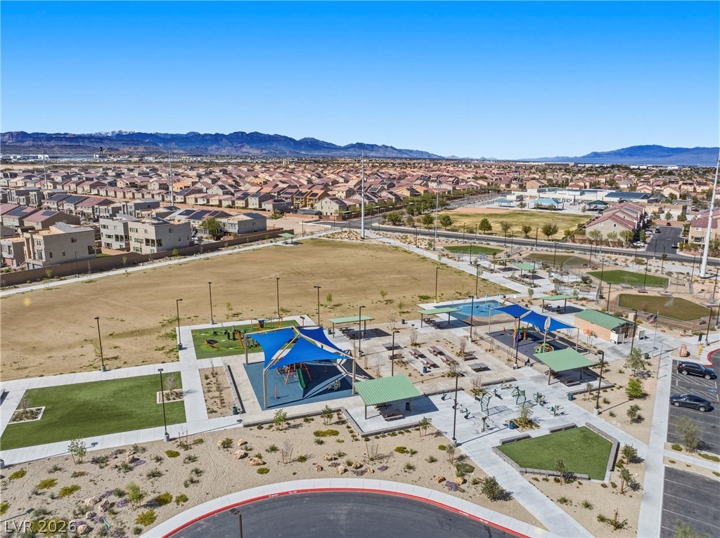 5953 Graystone Ridge Avenue Las Vegas, NV 89141 - Photo 46 of 51 Aerial view of the Battle Born Park with a mountain backdrop