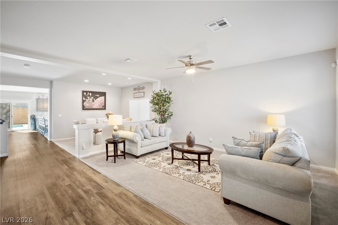 5953 Graystone Ridge Avenue Las Vegas, NV 89141 - Photo 5 of 51 Living room featuring ceiling fan, wood finished floors, and recessed lighting