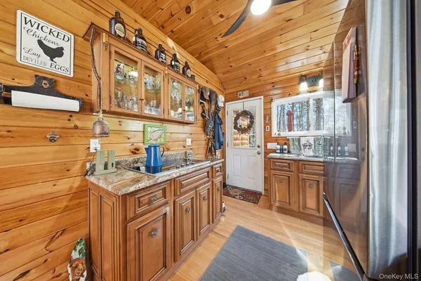 a kitchen with stainless steel appliances granite countertop a sink and cabinets