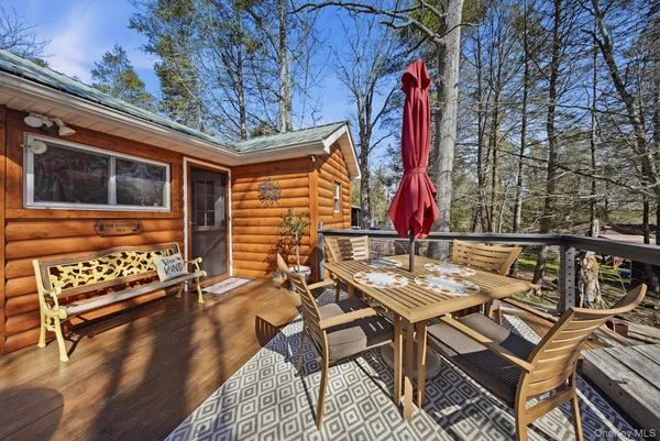 a view of a patio with a table and chairs