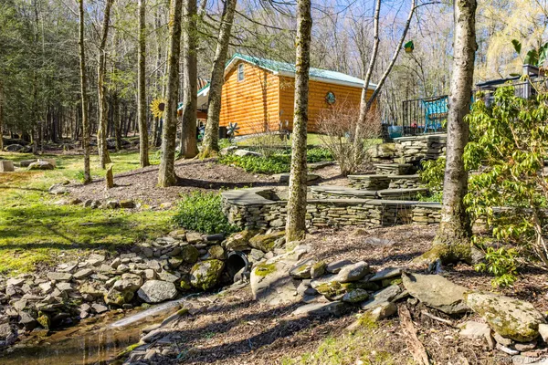 a view of multiple houses with a yard