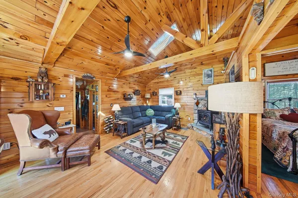 a view of a couch with wooden floor