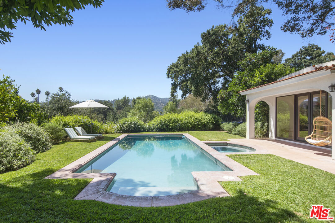 1095 Armada Drive Pasadena, CA 91103 - Photo 37 of 47 a view of a swimming pool with a yard