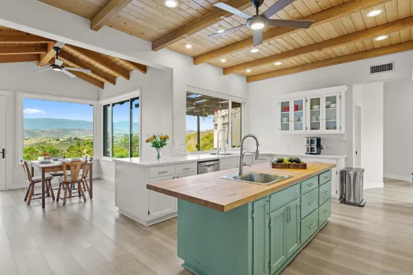a very nice looking kitchen with a large window