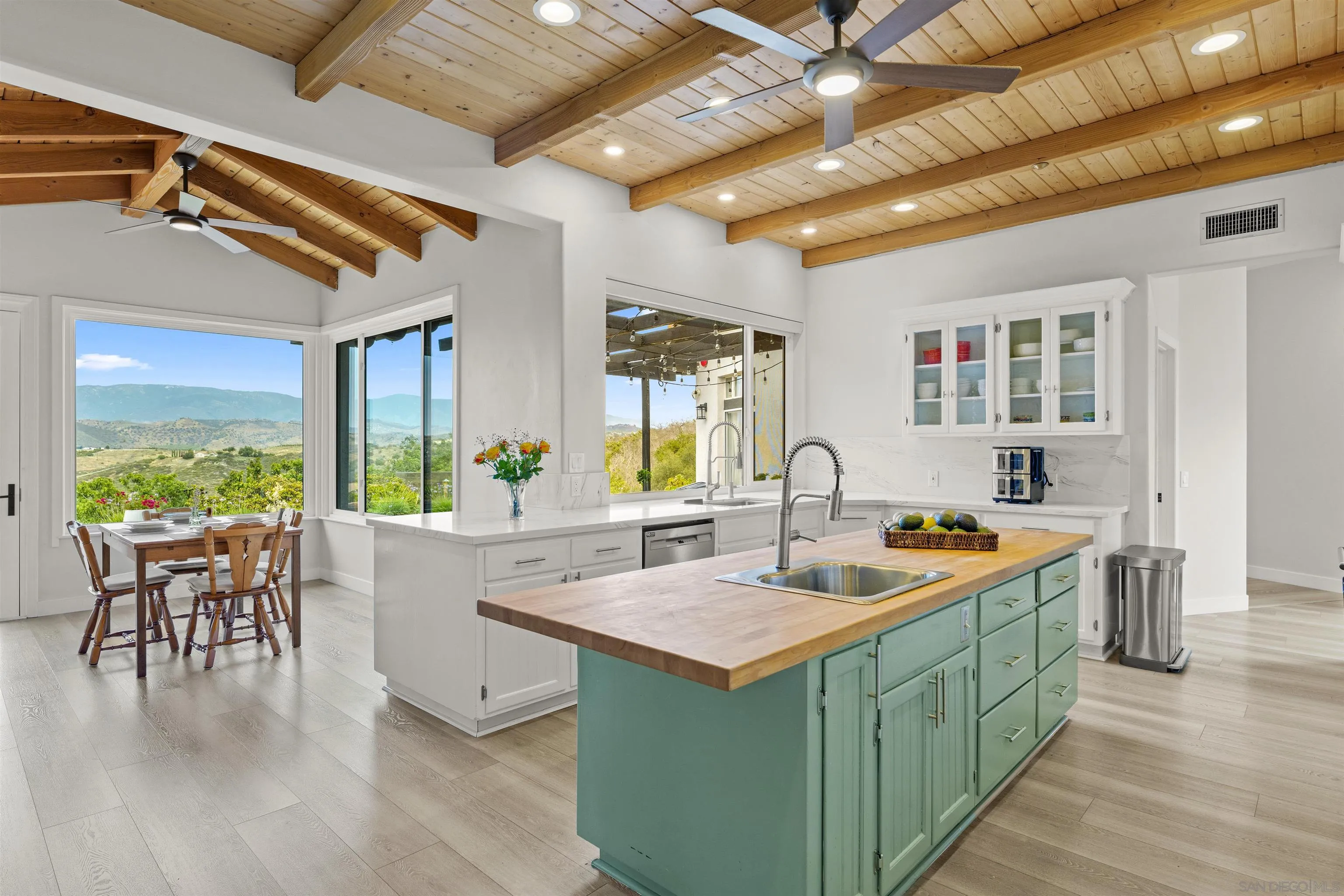 a very nice looking kitchen with a large window