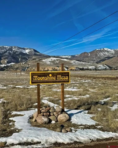 a view of a brick building with an ocean view
