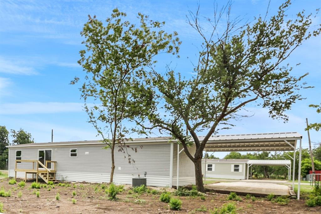 708 West 8th Street Coleman, TX 76834 - Photo 25 of 25 a front view of a house with garden