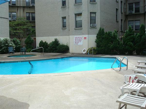 6 Sutherland Road, Unit 2 Boston, MA 02135 - Photo 7 of 9 a view of a swimming pool with a lounge chairs