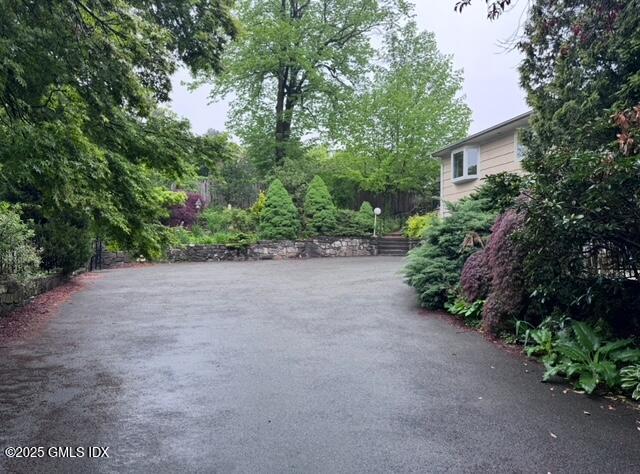 62 Byram Shore Road Greenwich, CT 06830 - Photo 7 of 7 a view of a house with a yard and plant