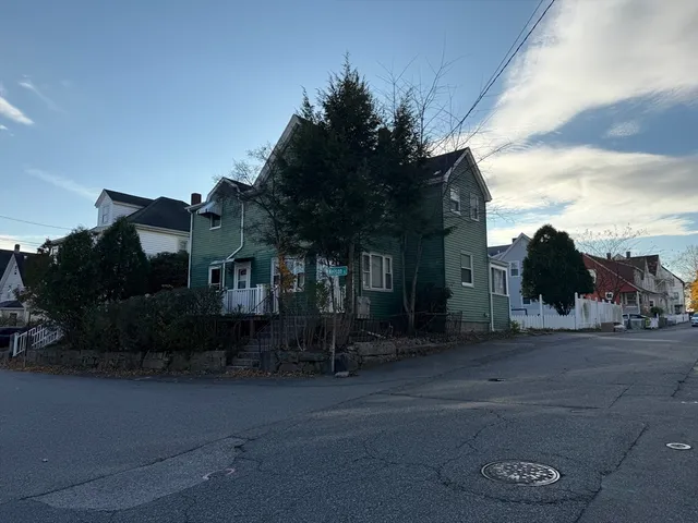 a view of a street with houses on both side
