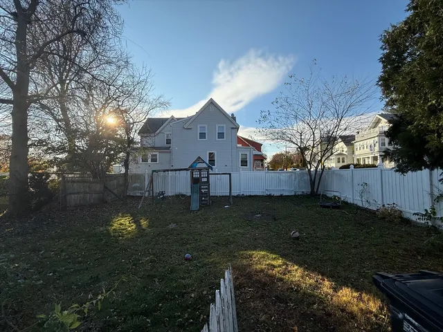 a backyard of a house with lots of green space