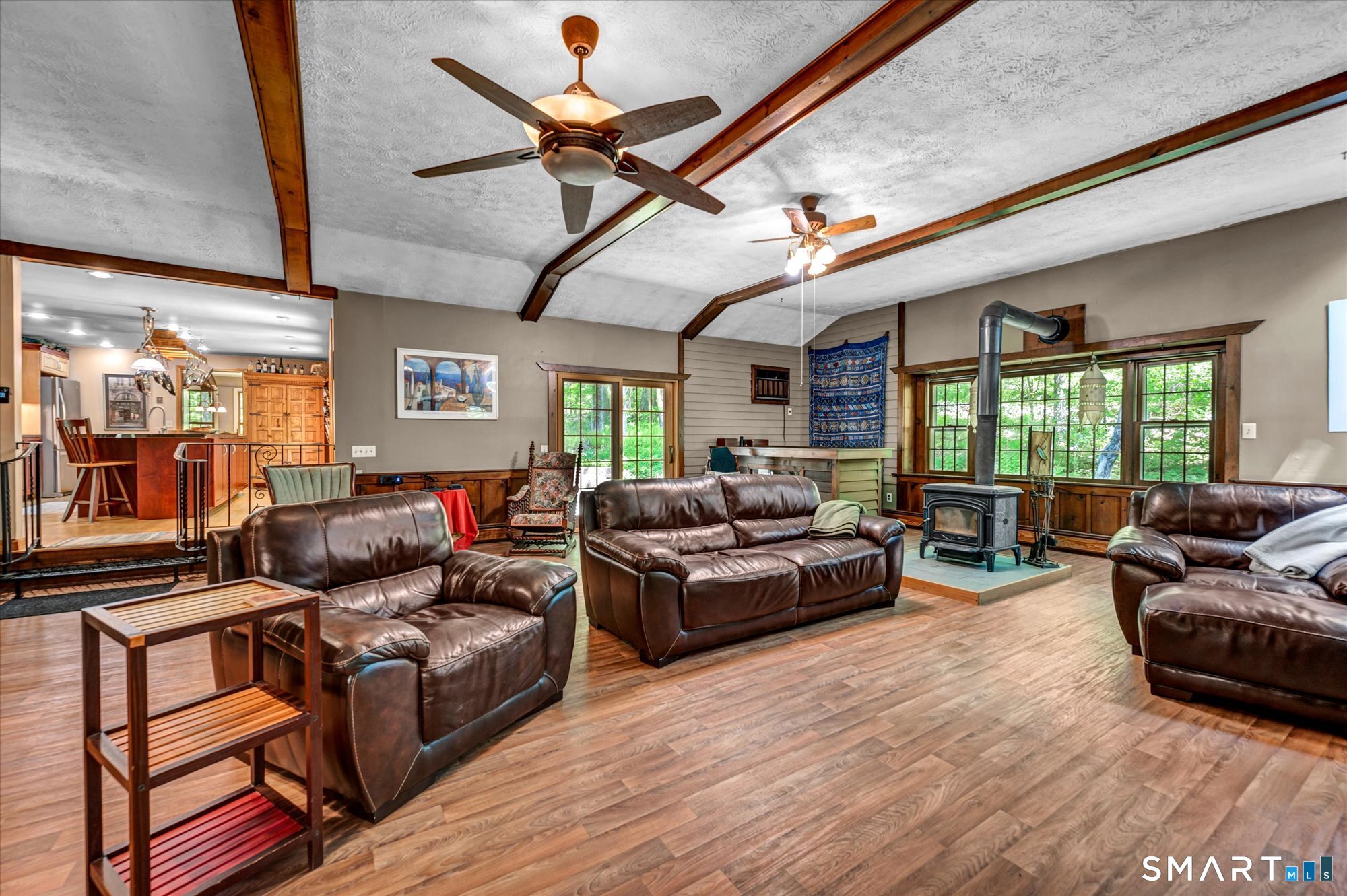 59 Indian Hill Road Canton, CT 06019 - Photo 17 of 39 a living room with furniture ceiling fan and a window