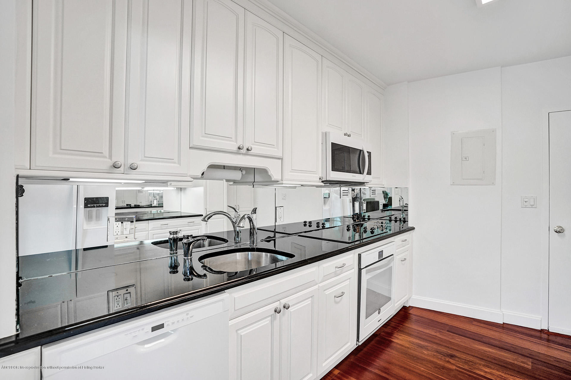 44 Cocoanut Row, Unit 308A Palm Beach, FL 33480 - Photo 12 of 22 a kitchen with granite countertop white cabinets and sink