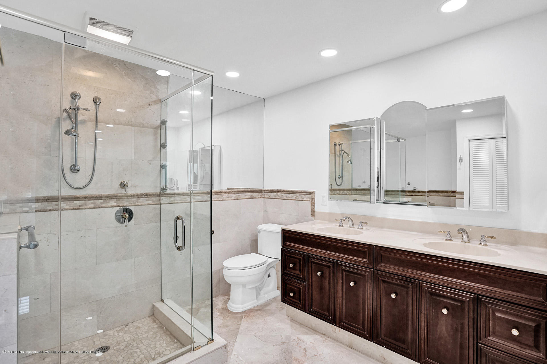 44 Cocoanut Row, Unit 308A Palm Beach, FL 33480 - Photo 16 of 22 a bathroom with a double vanity sink toilet mirror and shower