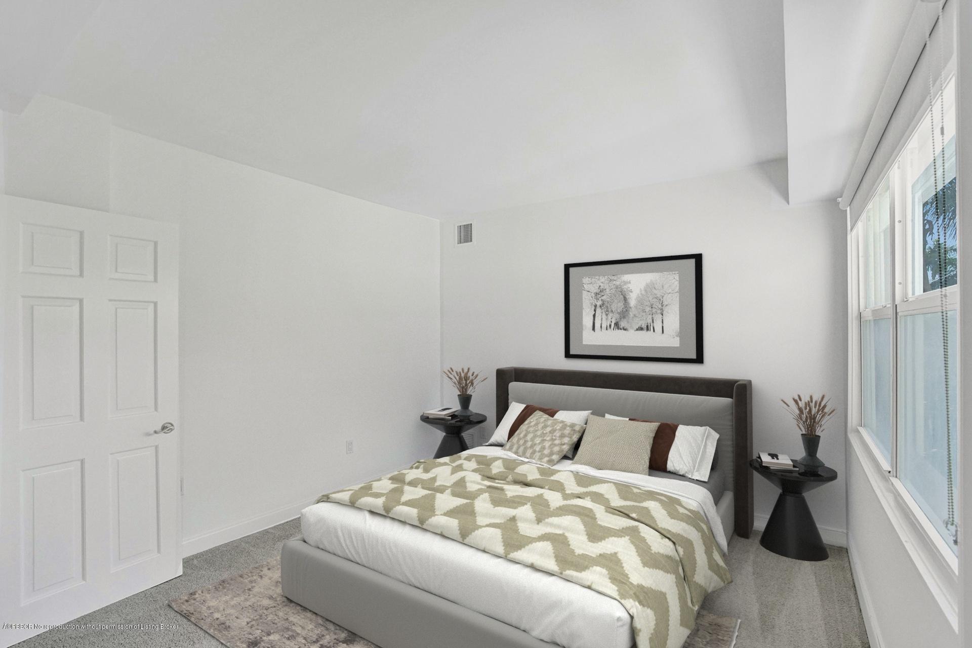 44 Cocoanut Row, Unit 308A Palm Beach, FL 33480 - Photo 19 of 22 a bedroom with a bed and a window