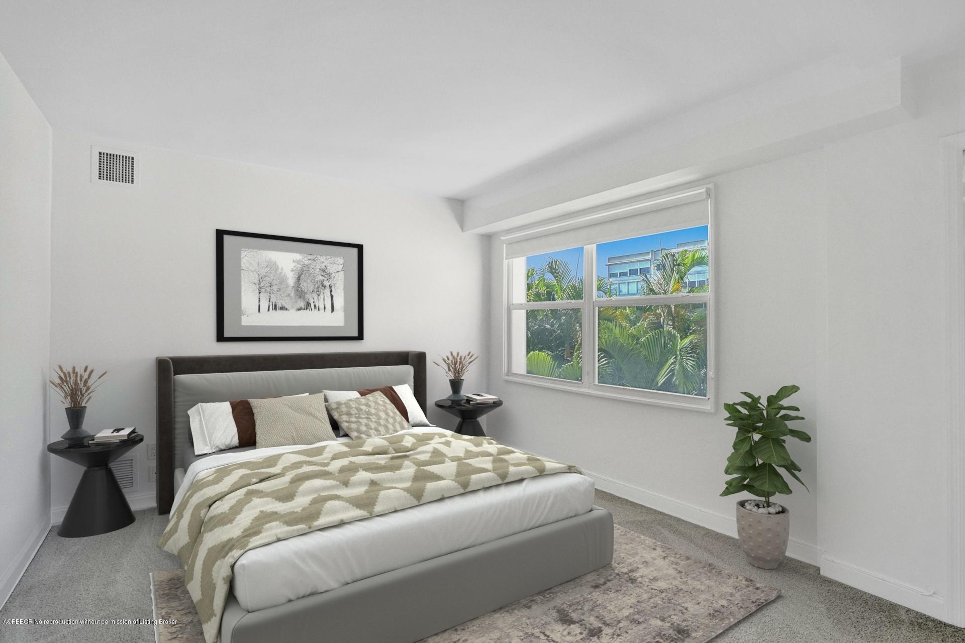 44 Cocoanut Row, Unit 308A Palm Beach, FL 33480 - Photo 21 of 22 a bedroom with a large bed and a potted plant