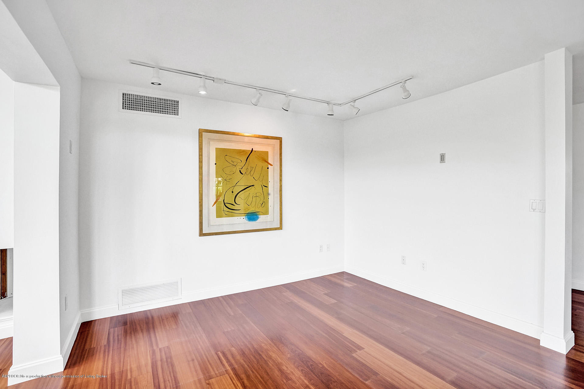 44 Cocoanut Row, Unit 308A Palm Beach, FL 33480 - Photo 6 of 22 a view of an empty room with wooden floor and a window