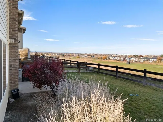 a view of ocean with boats and trees in the background