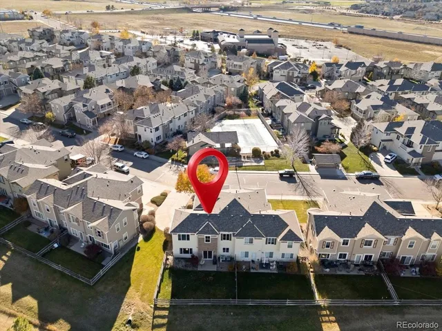 a view of multiple houses with yard