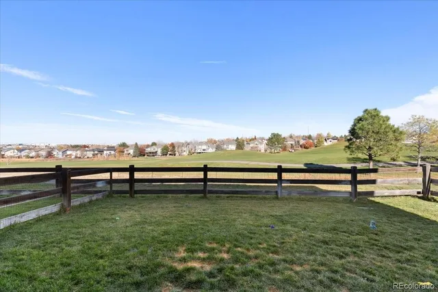 a view of outdoor space with seating area and trees