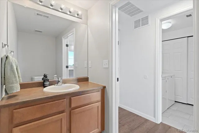 a bedroom with a large bed and a large window