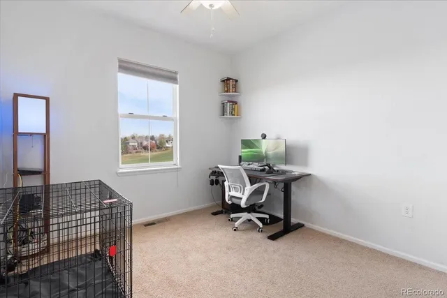 a front view of a house with a yard table and chairs