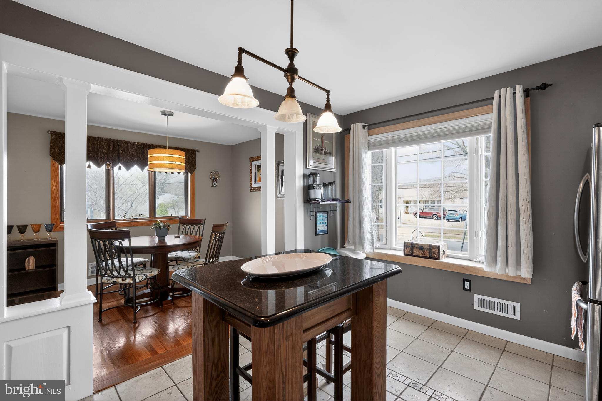 1001 Rydal Road Cherry Hill, NJ 08034 - Photo 11 of 47 a view of a dining room with furniture window and wooden floor